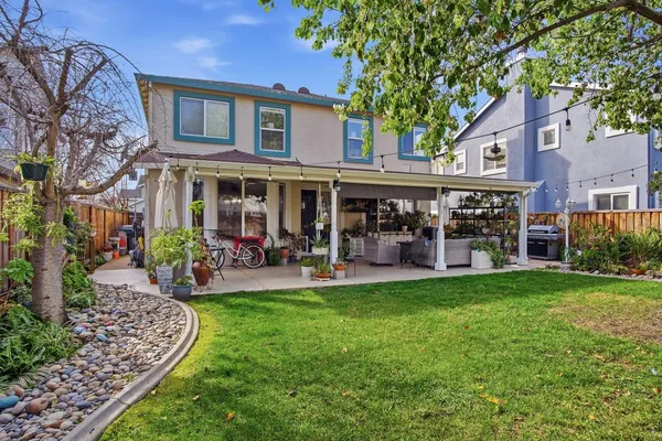a view of a house with a yard porch and sitting area