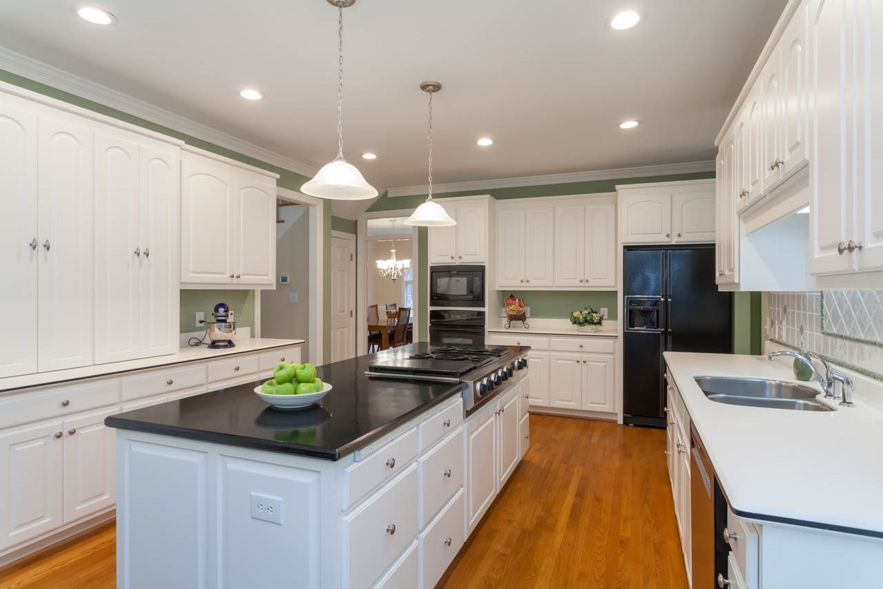 13921 Possum Track Road Raleigh, NC 27614 - Photo 12 of 25 Grand gourmet Kitchen with large center island and lots of counter and cabinet space. Kitchen