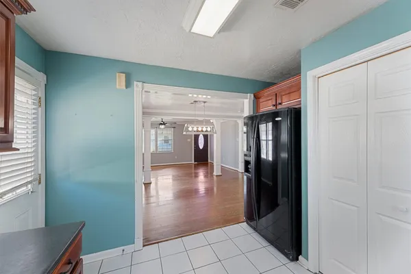 a view of a hallway with wooden shelves