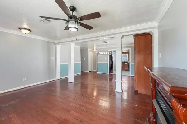 a view of an entryway with wooden floor