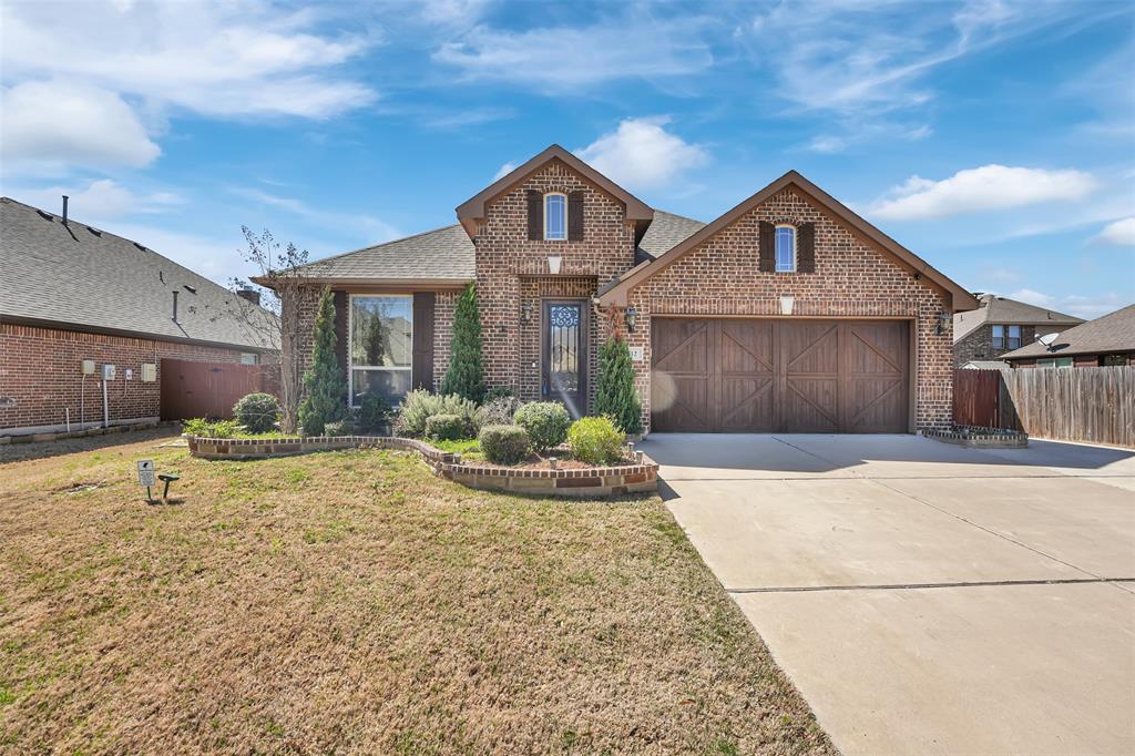 512 Carnation Lane Mansfield, TX 76063 - Photo 1 of 1 a front view of a house with a yard and garage
