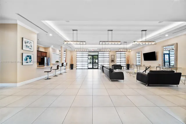 a view of swimming pool with outdoor seating and house in the background