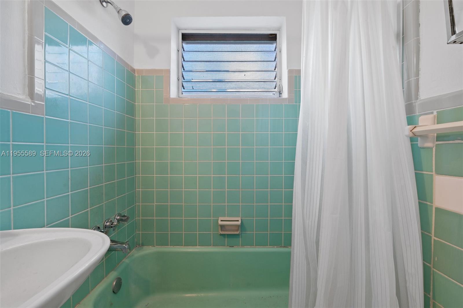 42 East 16th Street Hialeah, FL 33010 - Photo 15 of 30 a bathroom with a shower and a bathtub