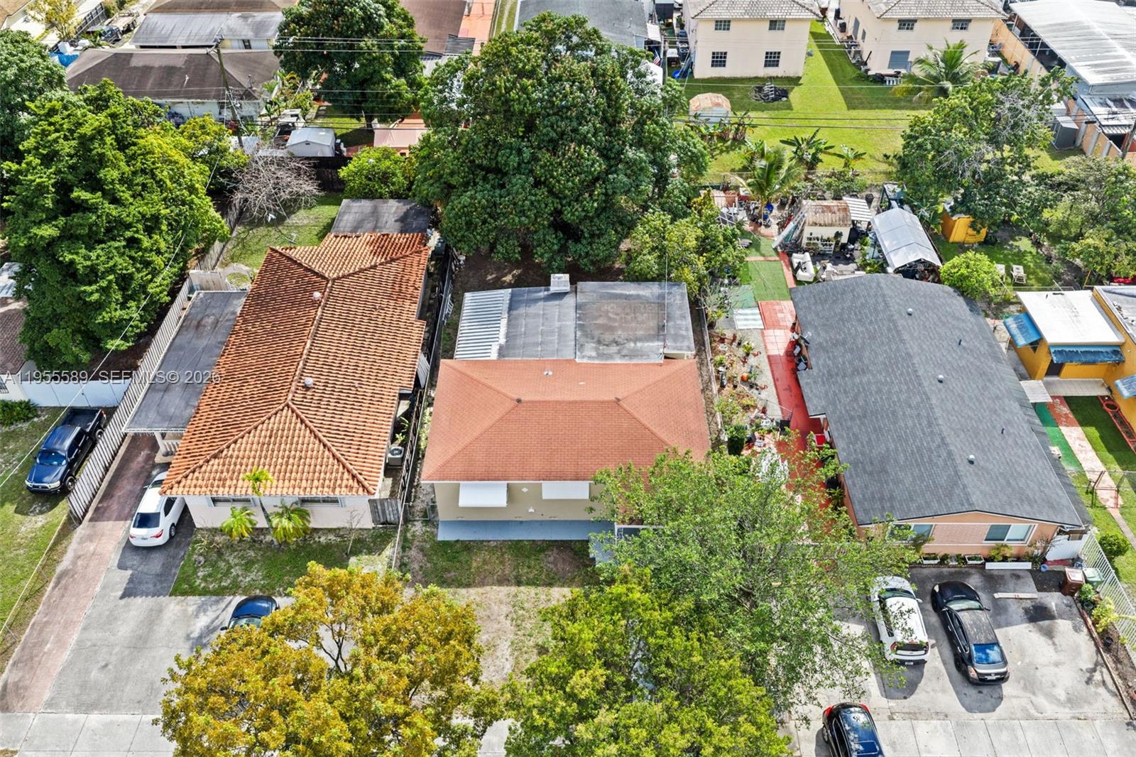 42 East 16th Street Hialeah, FL 33010 - Photo 2 of 30 an aerial view of a house with a garden and lake view
