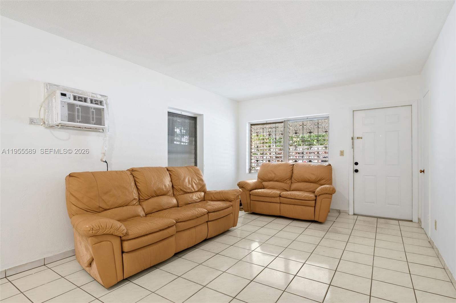 42 East 16th Street Hialeah, FL 33010 - Photo 7 of 30 a living room with furniture and a window