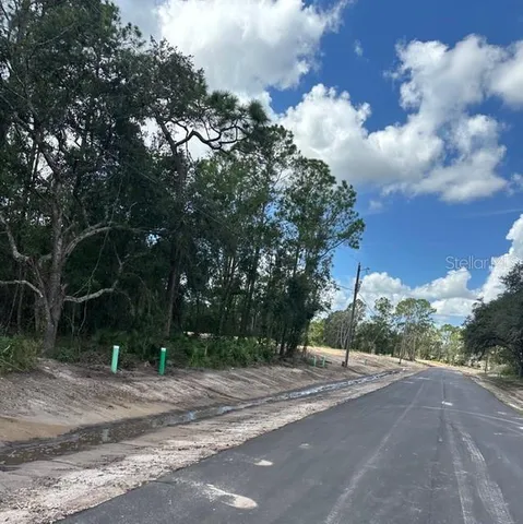 a view of a playground with basketball court