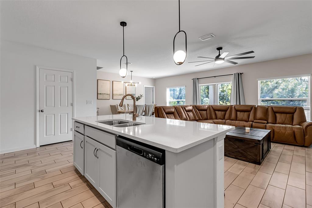 5434 Patano Loop Palmetto, FL 34221 - Photo 17 of 93 a large white kitchen with a large island