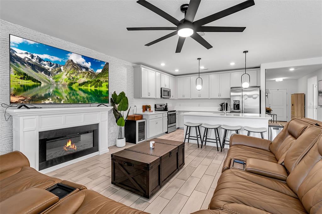 5434 Patano Loop Palmetto, FL 34221 - Photo 21 of 93 a living room with furniture and a fireplace