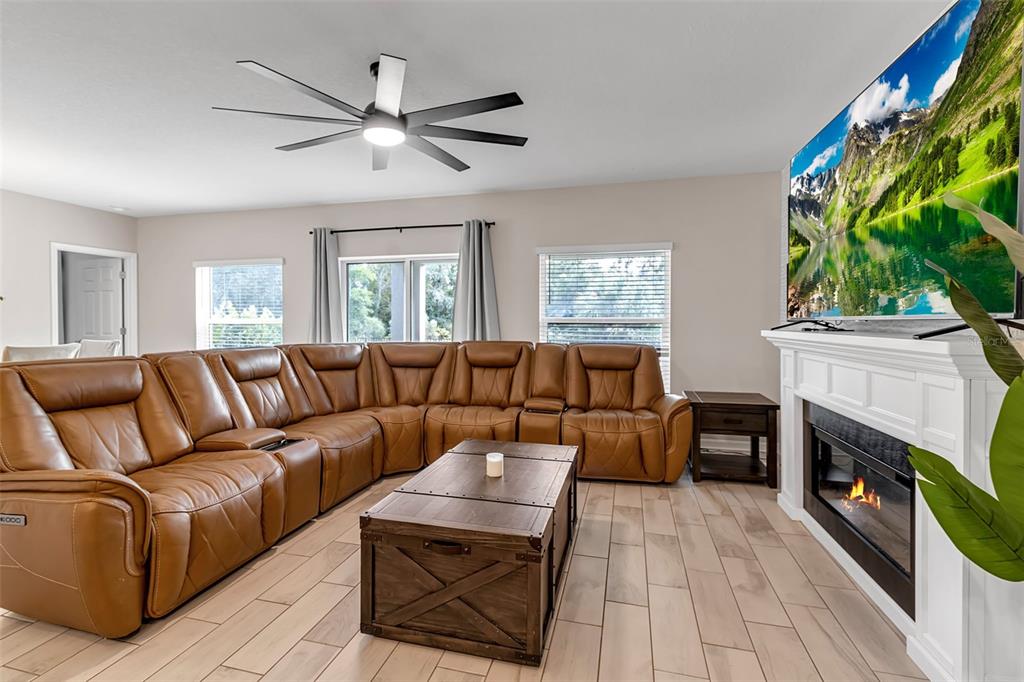 5434 Patano Loop Palmetto, FL 34221 - Photo 23 of 93 a living room with furniture and a fireplace