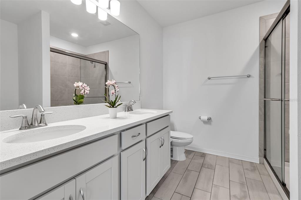 5434 Patano Loop Palmetto, FL 34221 - Photo 30 of 93 a bathroom with a double vanity sink and a mirror