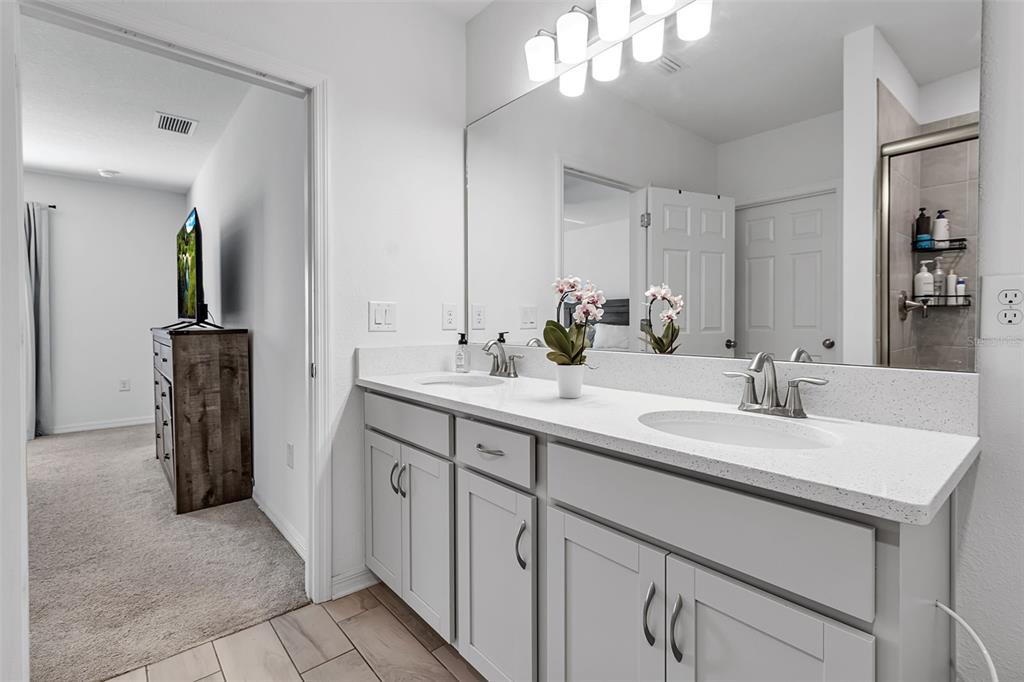 5434 Patano Loop Palmetto, FL 34221 - Photo 33 of 93 a bathroom with a sink and a mirror