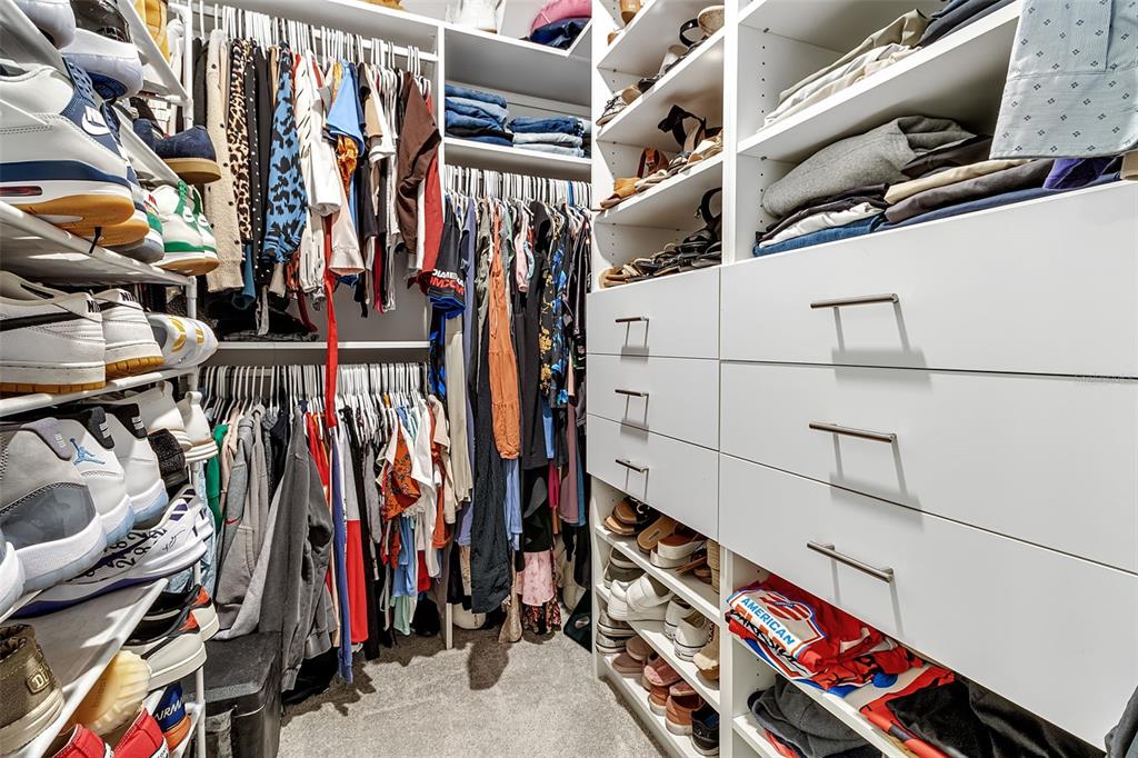 5434 Patano Loop Palmetto, FL 34221 - Photo 34 of 93 a view of walk in closet with clothes and shoes