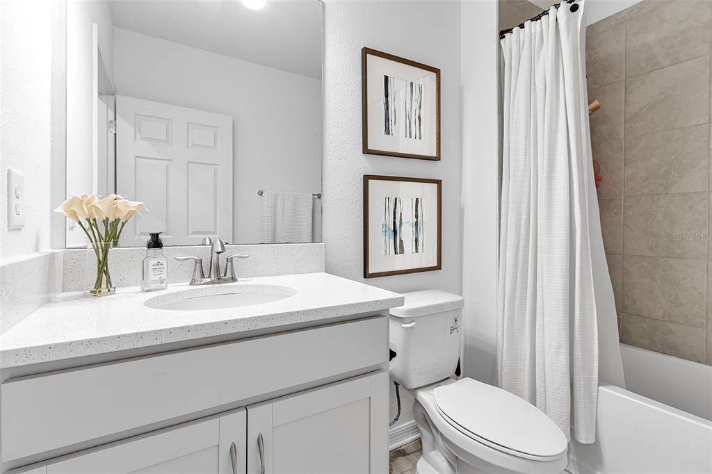 5434 Patano Loop Palmetto, FL 34221 - Photo 43 of 93 a bathroom with a toilet a sink and a mirror