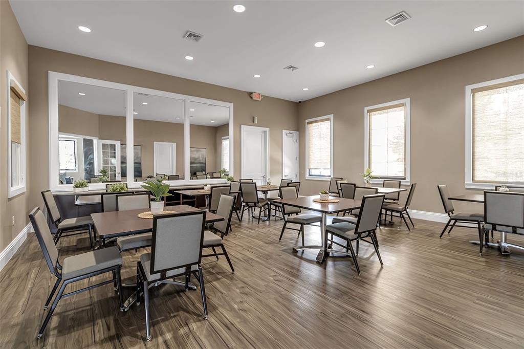 5434 Patano Loop Palmetto, FL 34221 - Photo 70 of 93 a view of a dining room with furniture window and wooden floor