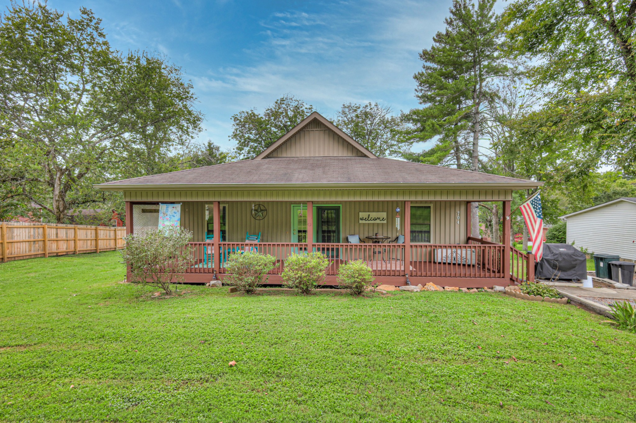 a front view of house with a garden and porch