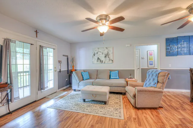 a living room with furniture and a window