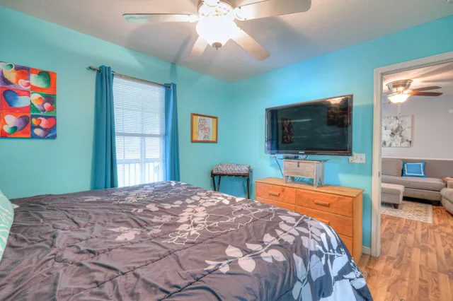 a bathroom with a sink a toilet a mirror and vanity