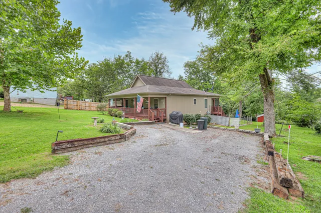a balcony with furniture and potted plants