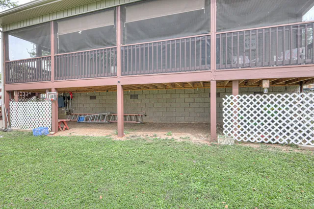 a backyard of a house with lots of green space and fountain