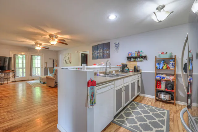 a kitchen with refrigerator and cabinets