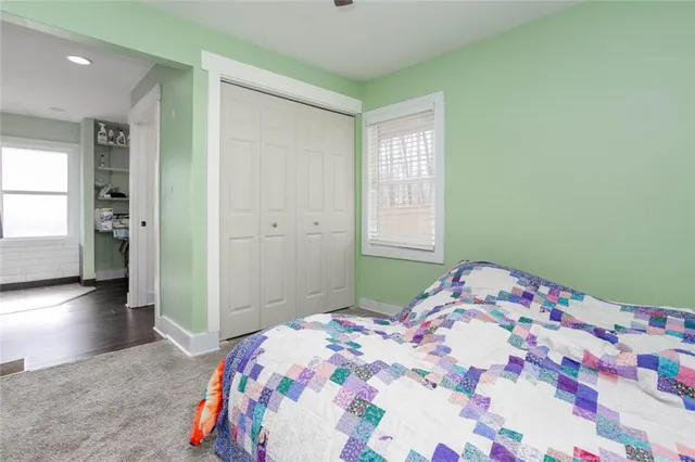 a bathroom with a toilet and a shower curtain