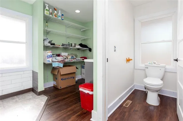 a kitchen with a sink and a mirror