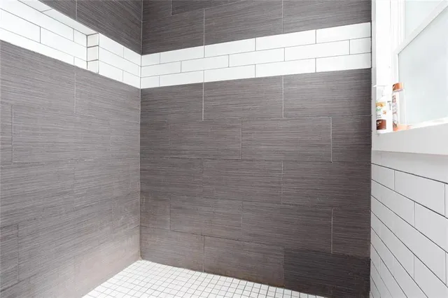 a view of a hallway view with wooden floor and entryway