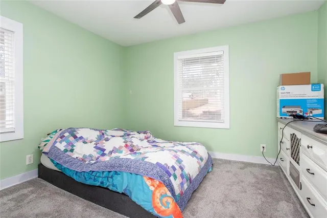 a kitchen with stainless steel appliances a refrigerator and a wooden cabinets