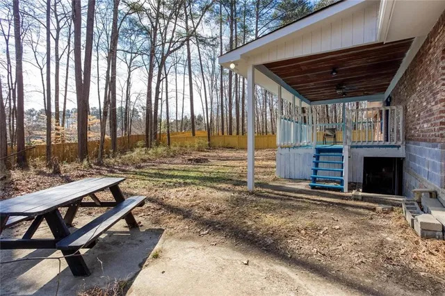 a view of front door of house with stairs