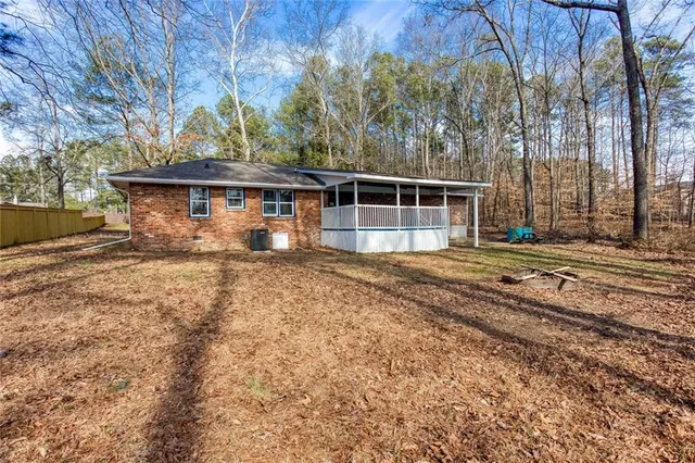 a house with trees in the background