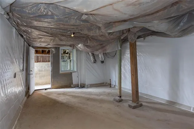 a view of a room with wooden walls