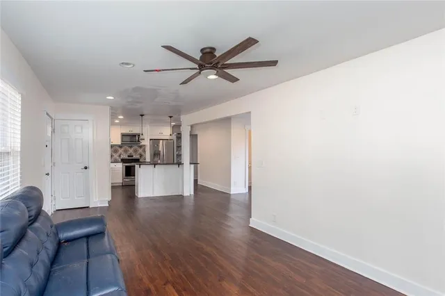 a view of kitchen view wooden floor and window