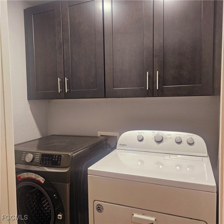 3780 Randall Boulevard Naples, FL 34120 - Photo 5 of 12 a utility room with dryer and washer