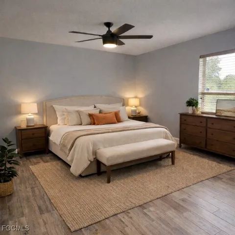 a bedroom with bed and window