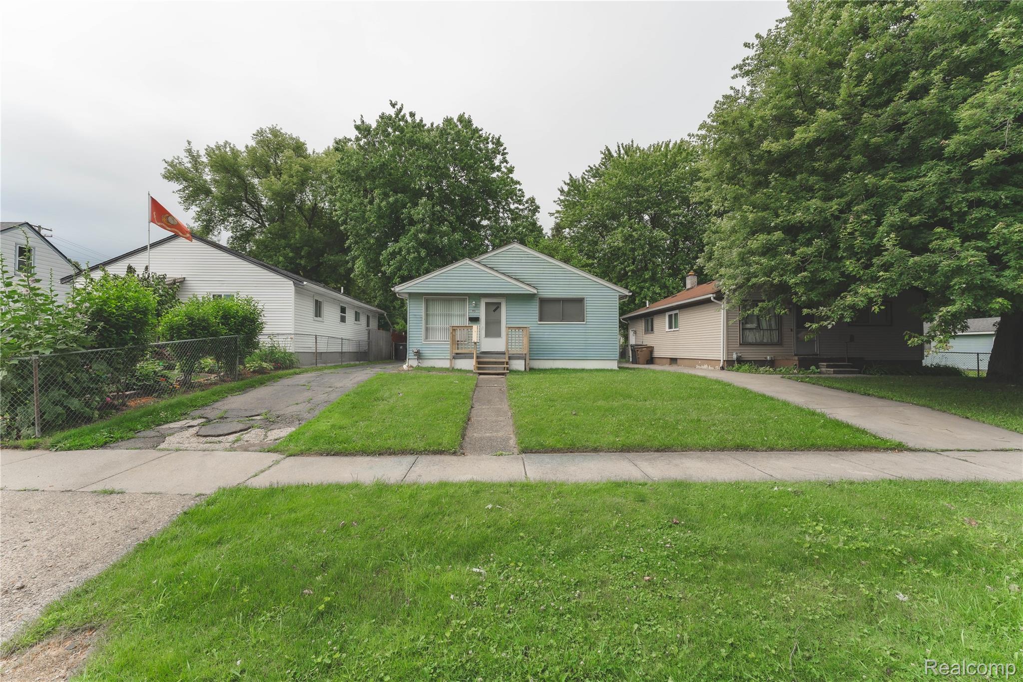 93 West Princeton Avenue Pontiac, MI 48340 - Photo 29 of 31 Single-story residence featuring light blue siding and a covered front entry