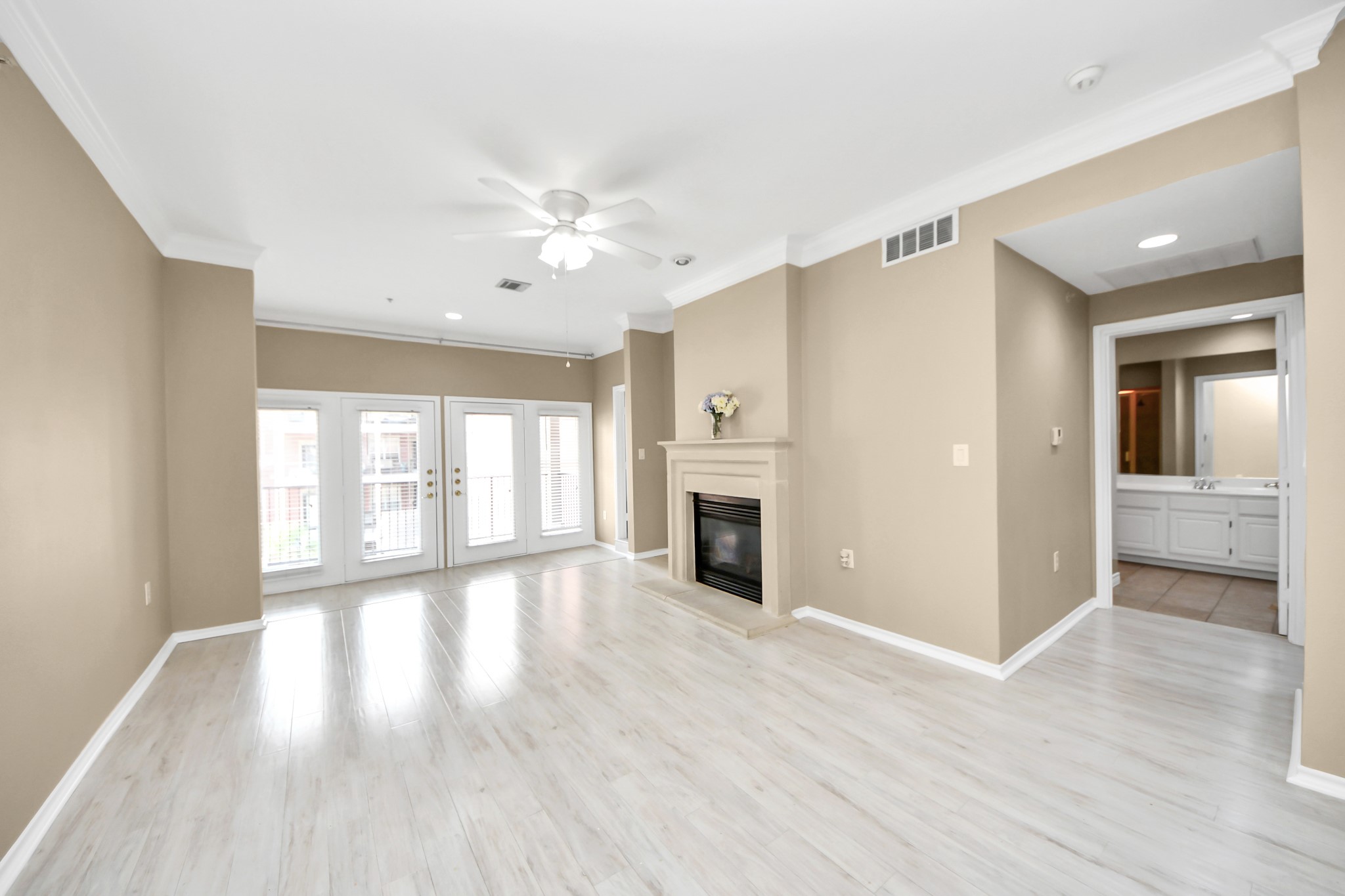2400 McCue Road, Unit 333 Houston, TX 77056 - Photo 13 of 50 a view of an empty room with window and wooden floor