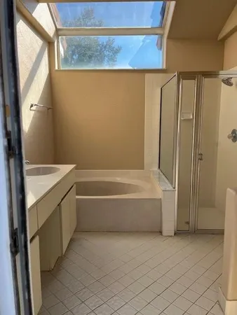 a bathroom with a bathtub and a shower