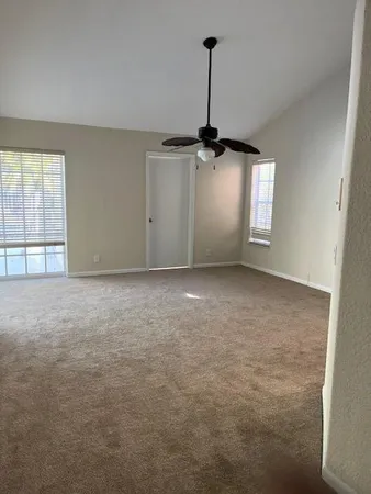 a view of an empty room and a window