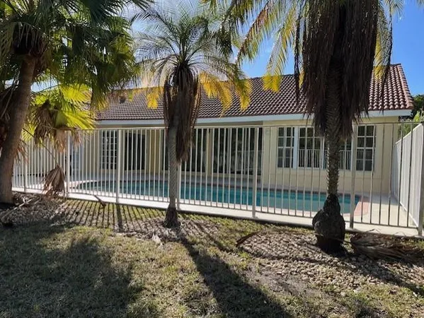 a view of a wrought iron fences in front of a house