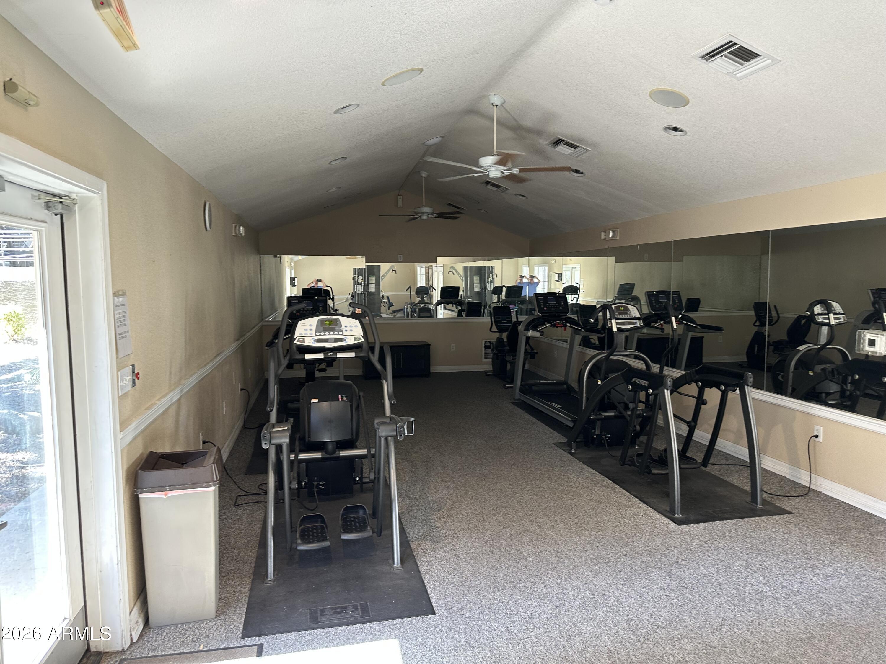 1720 East Thunderbird Road, Unit 1019 Phoenix, AZ 85022 - Photo 44 of 47 a room with gym equipment and a view of living room
