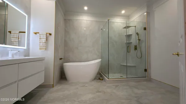 a bathroom with a shower and a sink