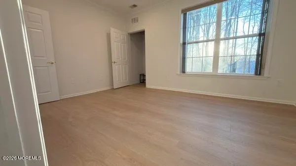 a bathroom with a double vanity sink toilet and shower