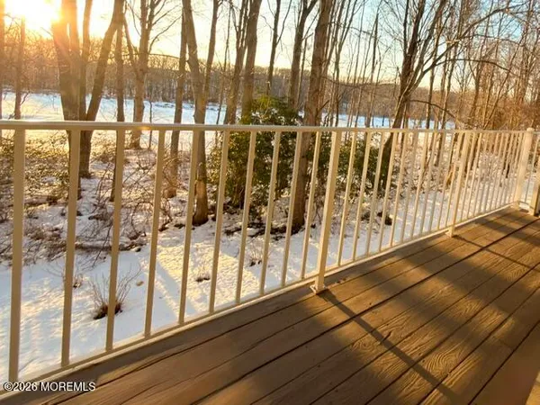 a view of wooden floor with a glass door