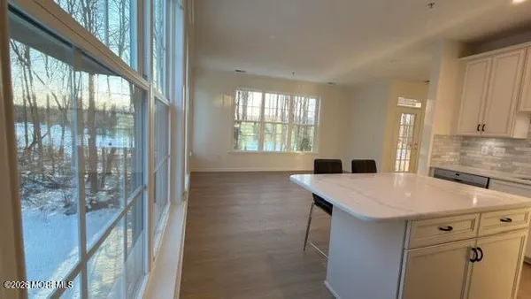 a kitchen that has a sink a stove and a refrigerator