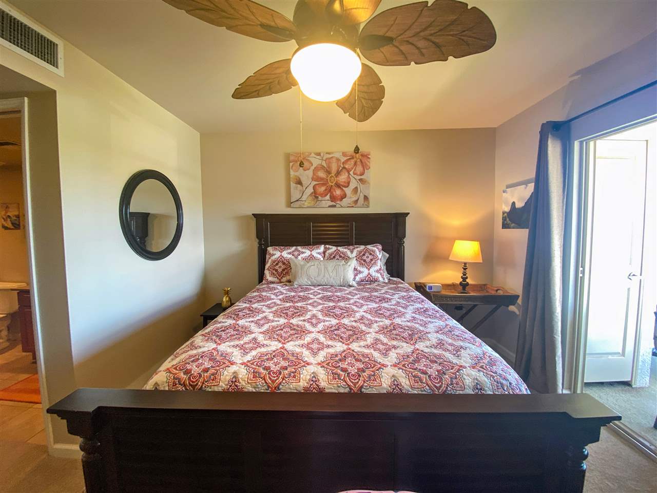 44 Kanani Road, Unit 2202 Kihei, HI 96753 - Photo 14 of 30 a bed sitting in a bedroom next to a window