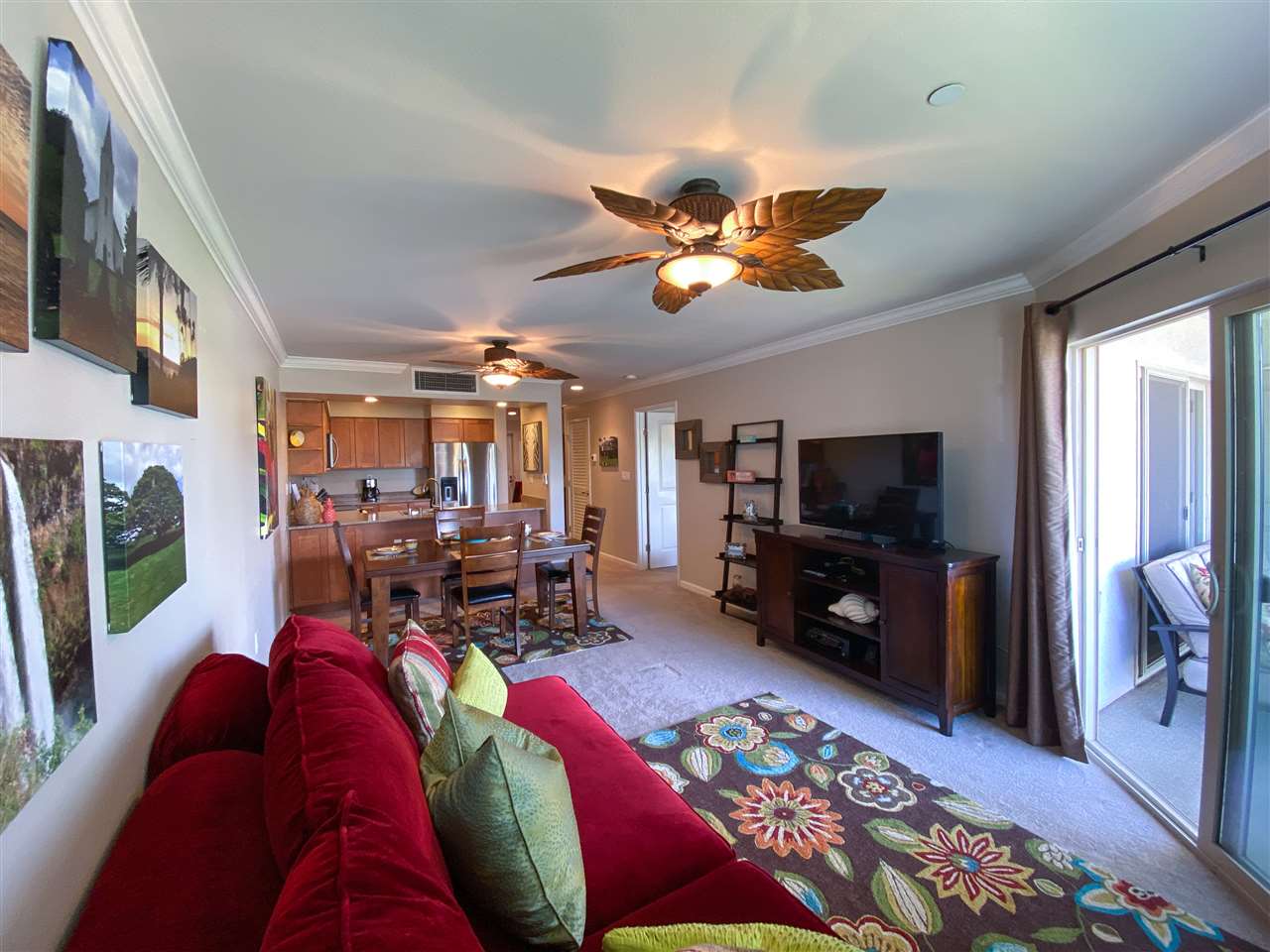 44 Kanani Road, Unit 2202 Kihei, HI 96753 - Photo 9 of 30 a living room with furniture a window and a flat screen tv