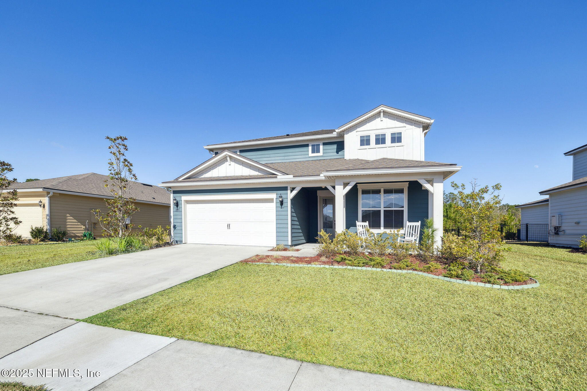 100 Red Barn Road St. Augustine, FL 32092 - Photo 4 of 86 a view of a white house with a big yard and large tree