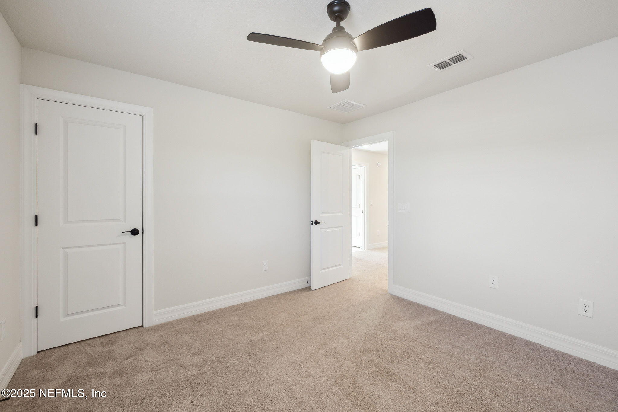 100 Red Barn Road St. Augustine, FL 32092 - Photo 42 of 86 en empty room with ceiling fan and window