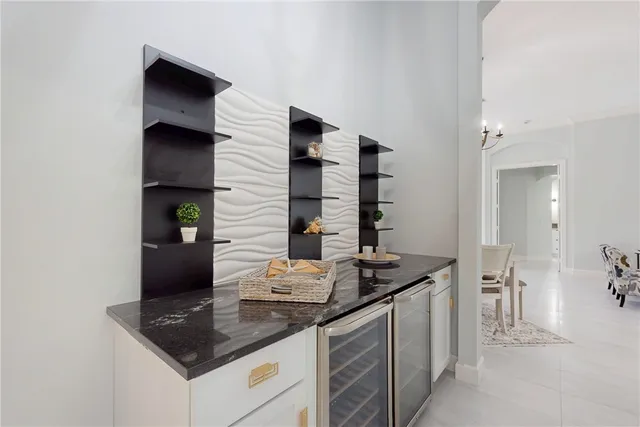 a kitchen with stainless steel appliances granite countertop a sink and a stove