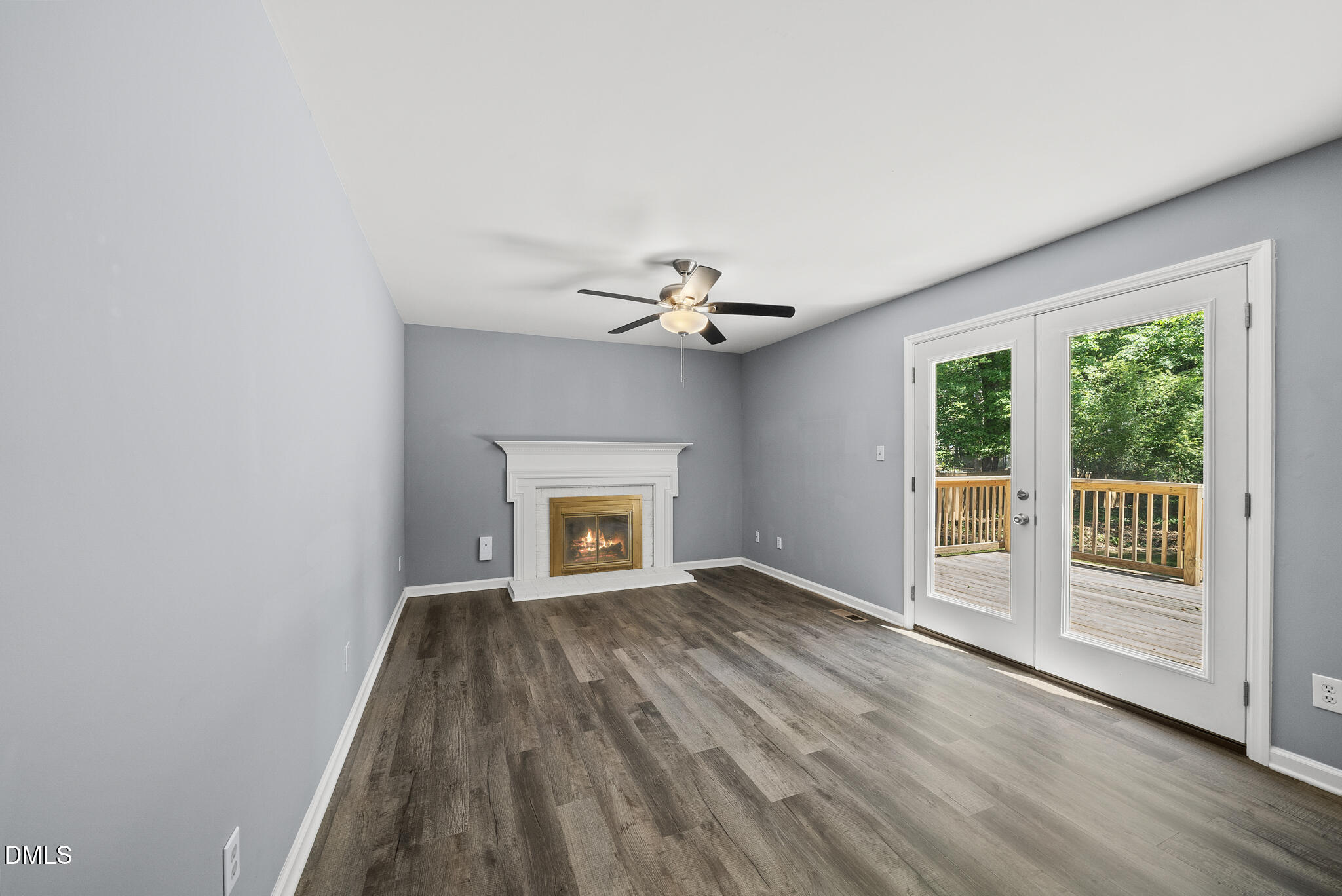 2108 Treverton Place Raleigh, NC 27609 - Photo 6 of 30 a view of an empty room with a window and wooden floor